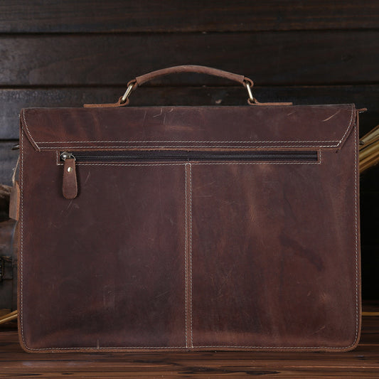Brown leather briefcase on a wooden surface with a dark wooden background