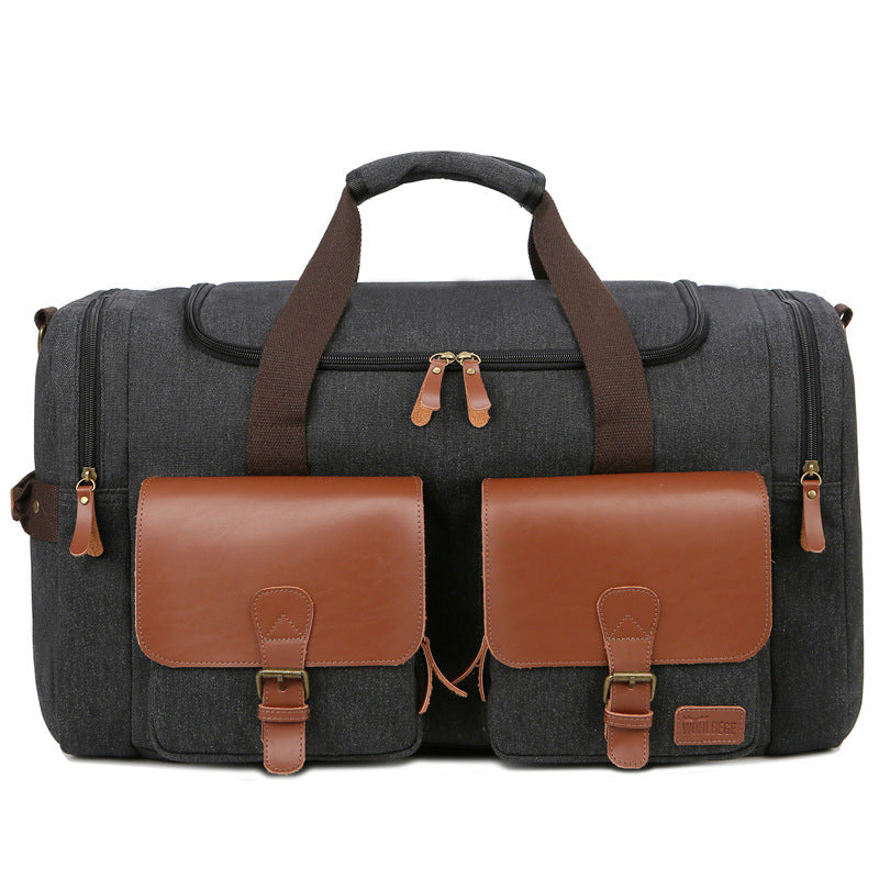 Gray duffel bag with brown leather accents on a white background
