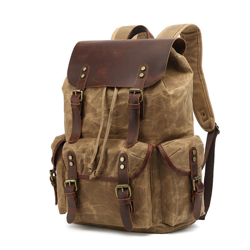Brown backpack with leather accents on a white background