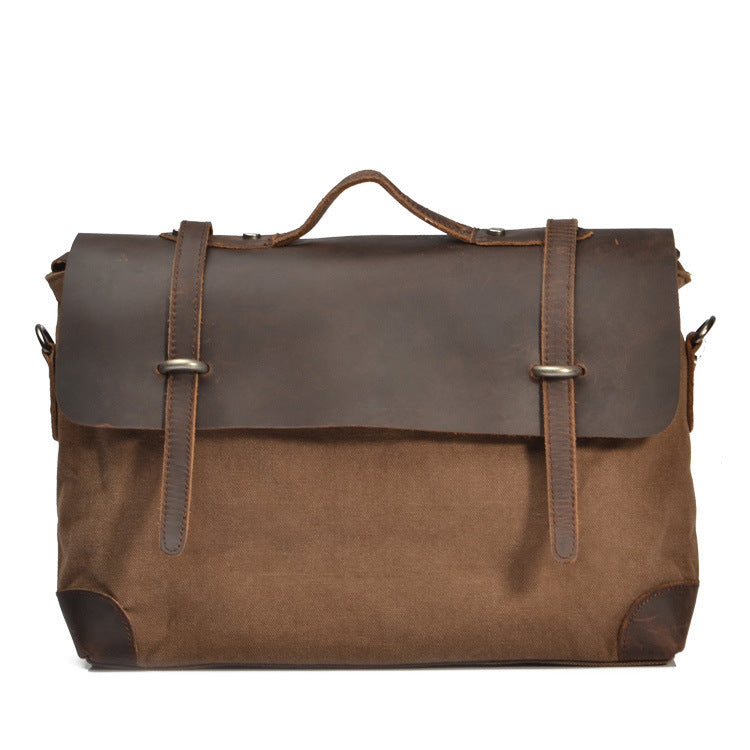 Brown leather and canvas bag with straps on a white background