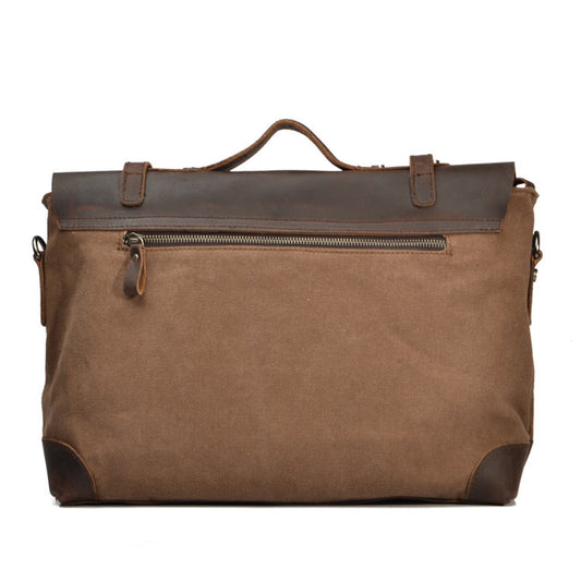 Brown leather duffel bag on a white background
