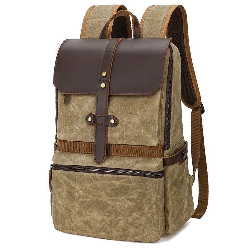 Brown backpack with leather accents on a white background