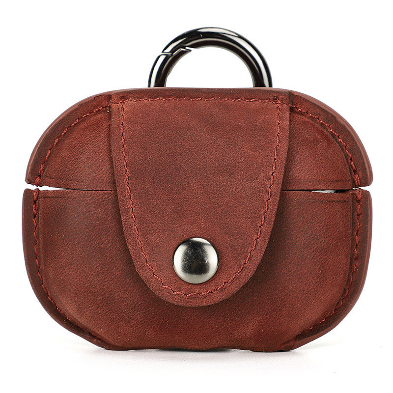 Brown leather case with a silver button and black ring on a white background