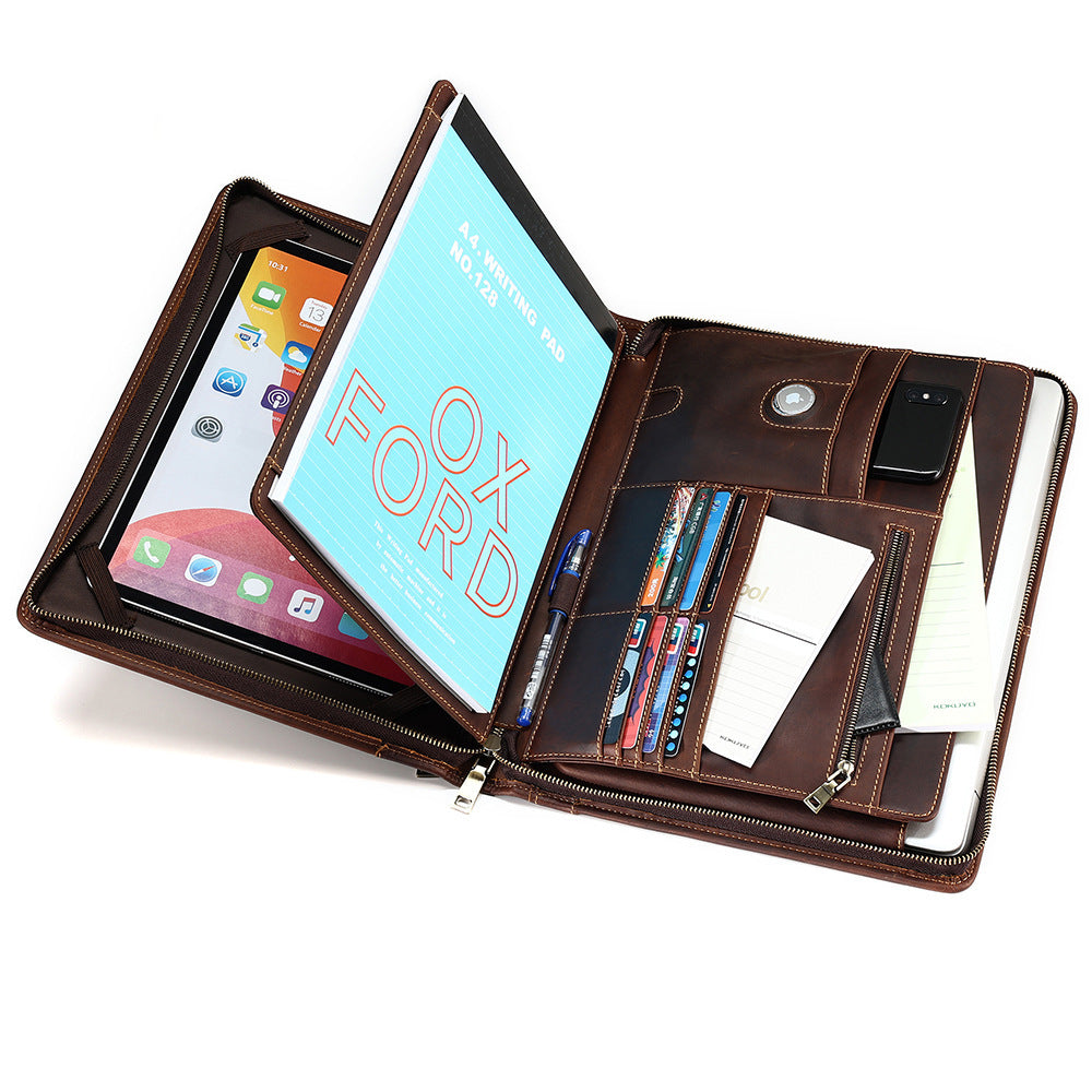Brown leather multi-device case with tablet, phone, and books inside on a white background