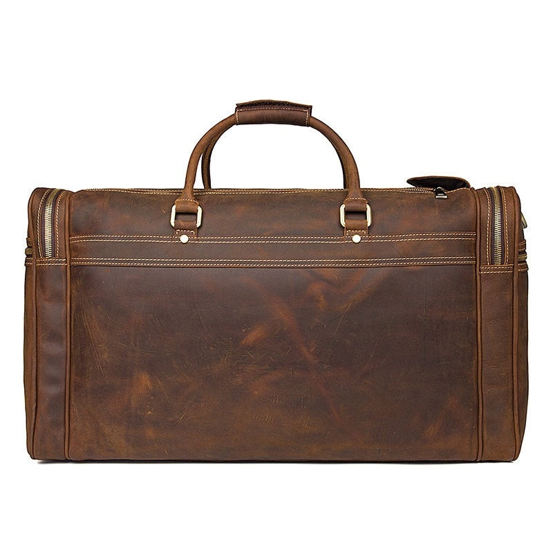 Brown leather duffel bag on a white background