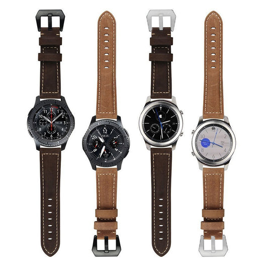 Four watches with brown leather straps on a white background