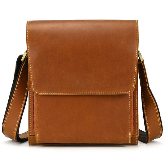 Brown leather crossbody bag on a white background