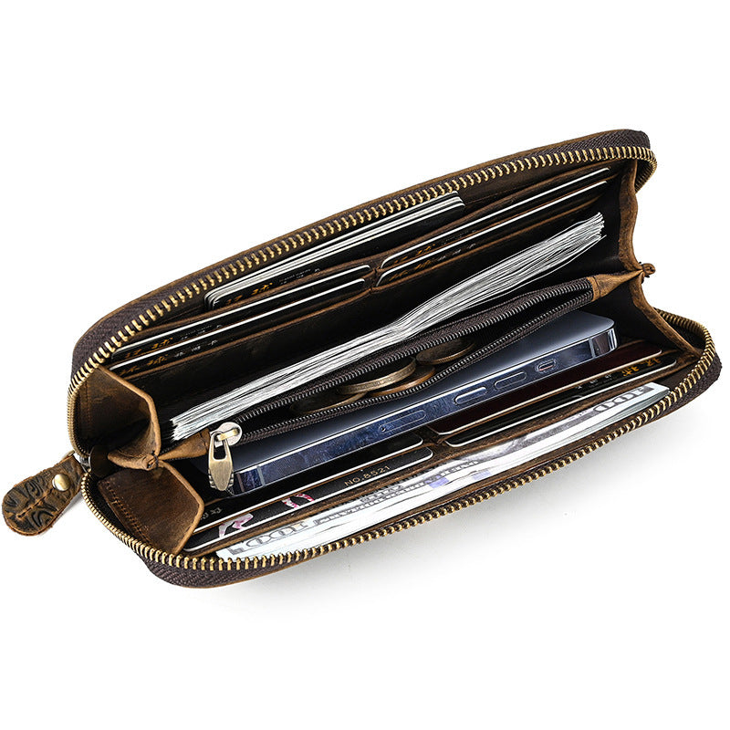 Brown leather wallet with multiple compartments on a white background