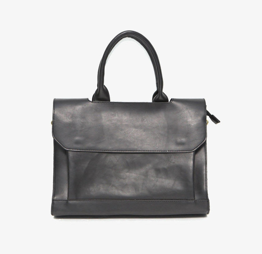 Black leather handbag on a white background
