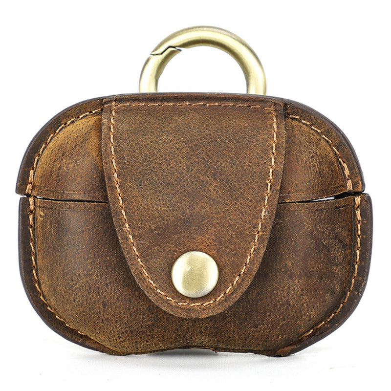 Brown leather keychain with gold accent on a white background