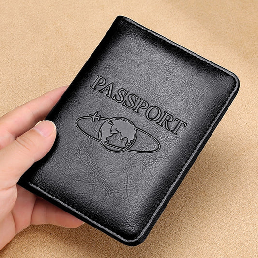 Black passport holder with 'PASSPORT' embossed text held by a hand on a beige background