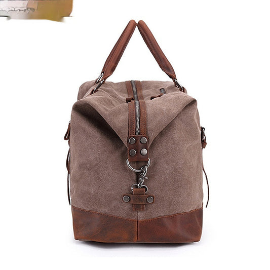 Brown canvas backpack with leather accents on a white background