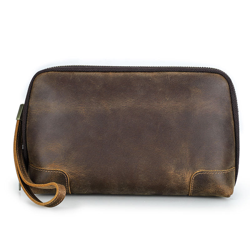 Brown leather clutch bag on a white background