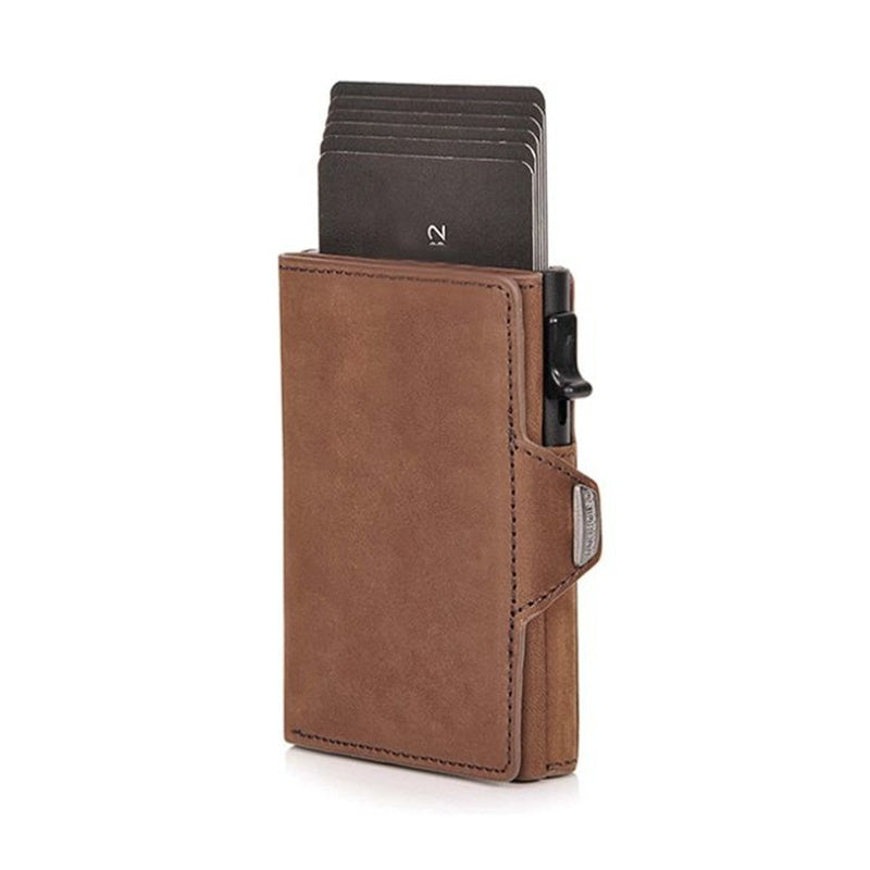 Brown leather cardholder with cards on a white background