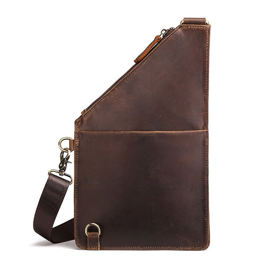 Brown leather sling bag with strap on a white background