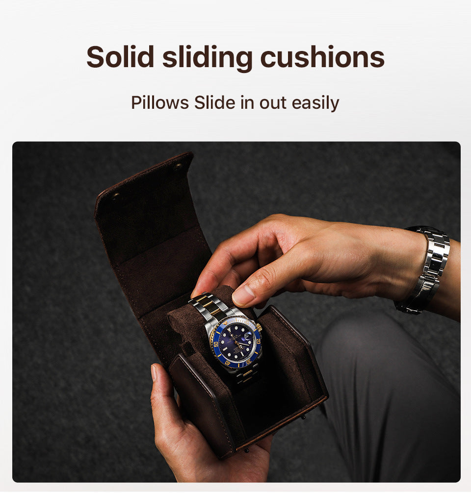 Person opening a brown watch box with a silver watch, text 'Solid sliding cushions' and 'Pillows Slide in out easily'.