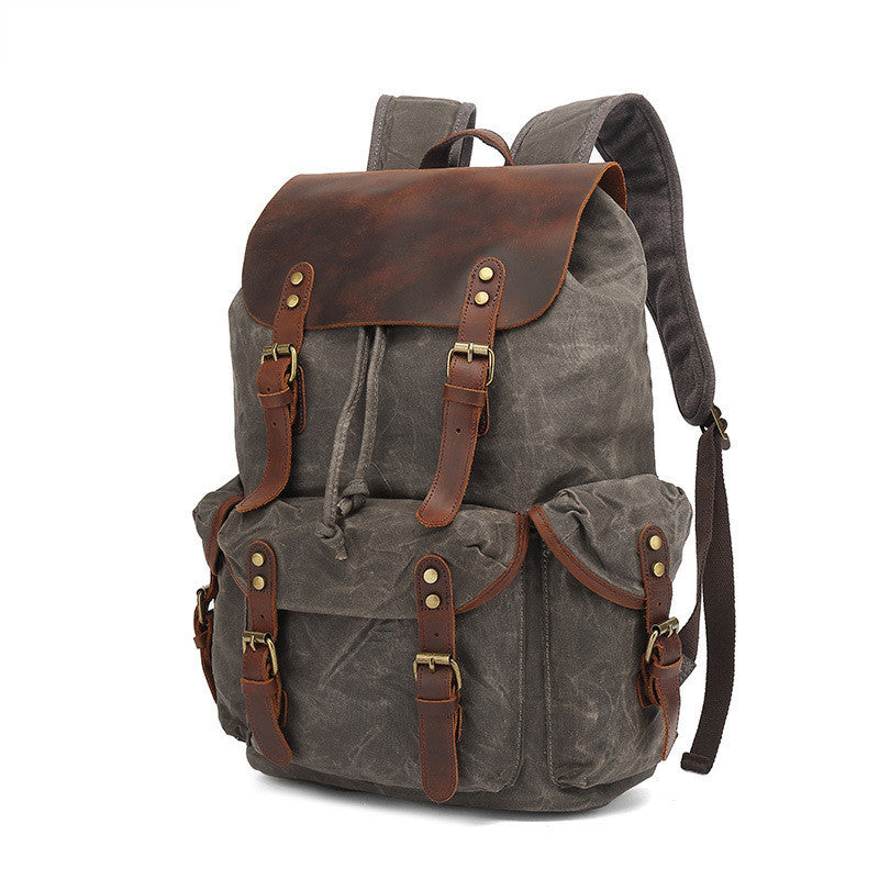 Gray backpack with brown leather accents on a white background