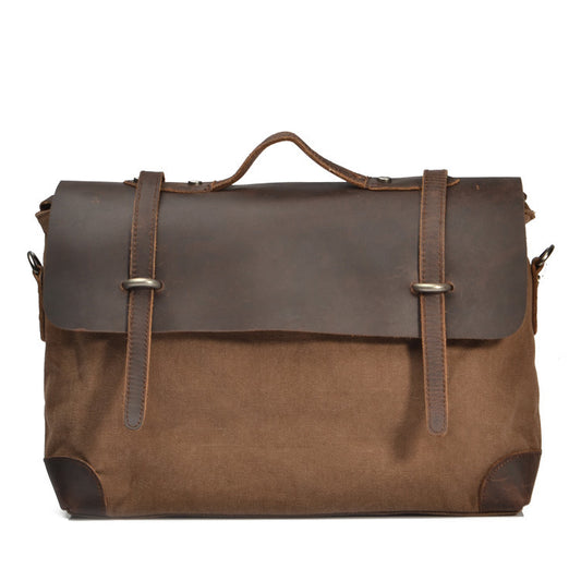 Brown leather and canvas bag with straps on a white background