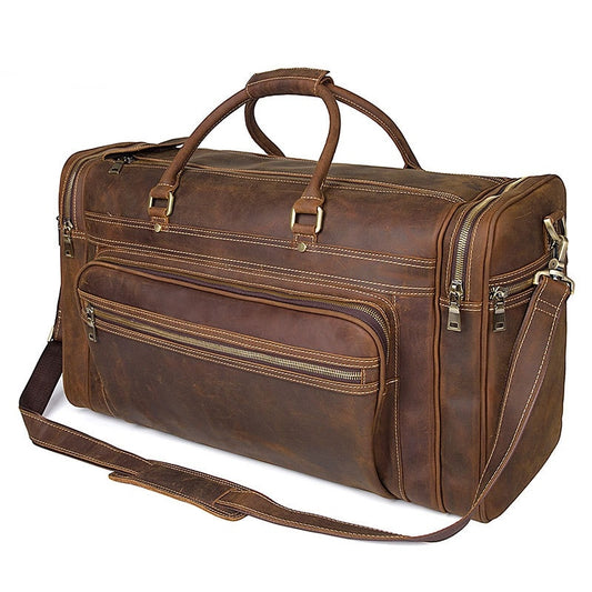 Brown leather duffel bag with multiple zippers on a white background