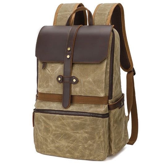 Brown backpack with leather accents on a white background