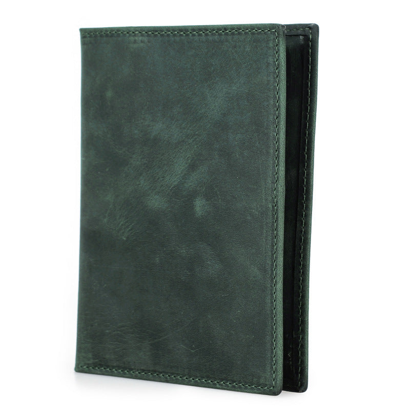 Green leather wallet on a white background