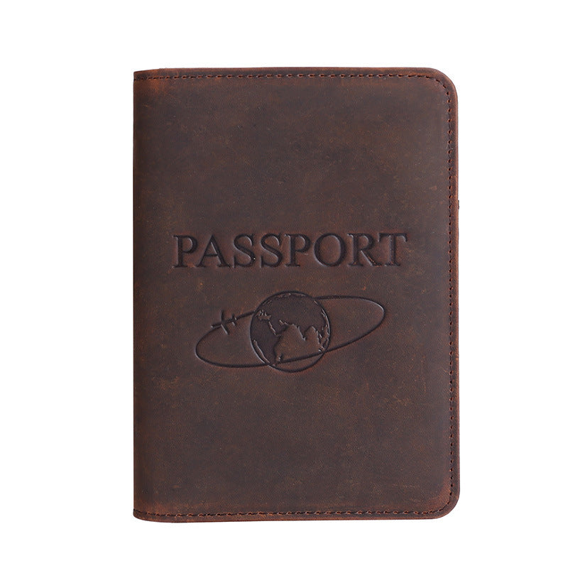 Brown leather passport holder with 'PASSPORT' embossing on a white background