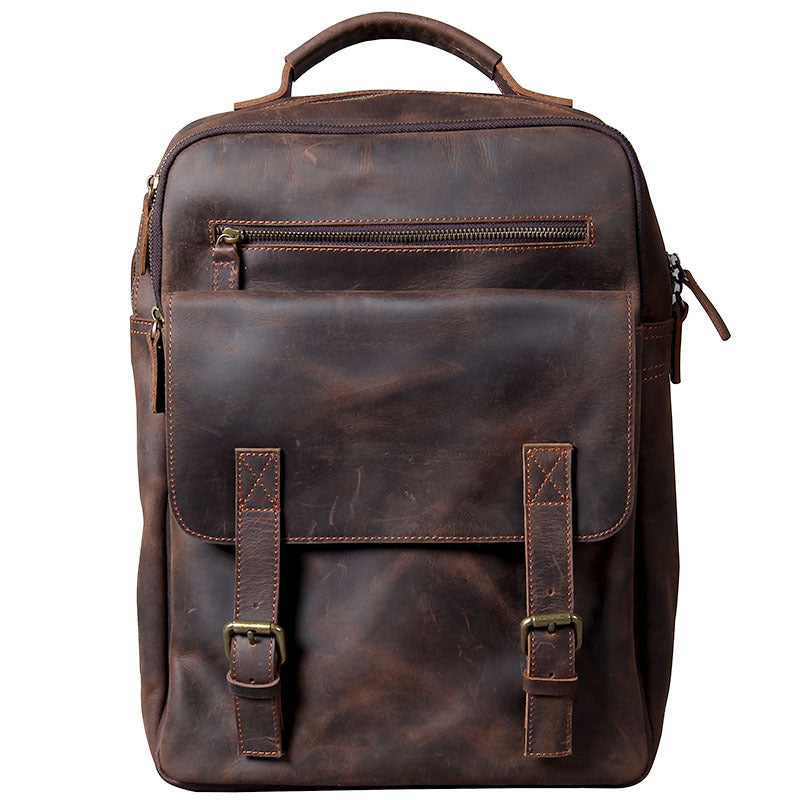 Brown leather backpack with straps on a white background