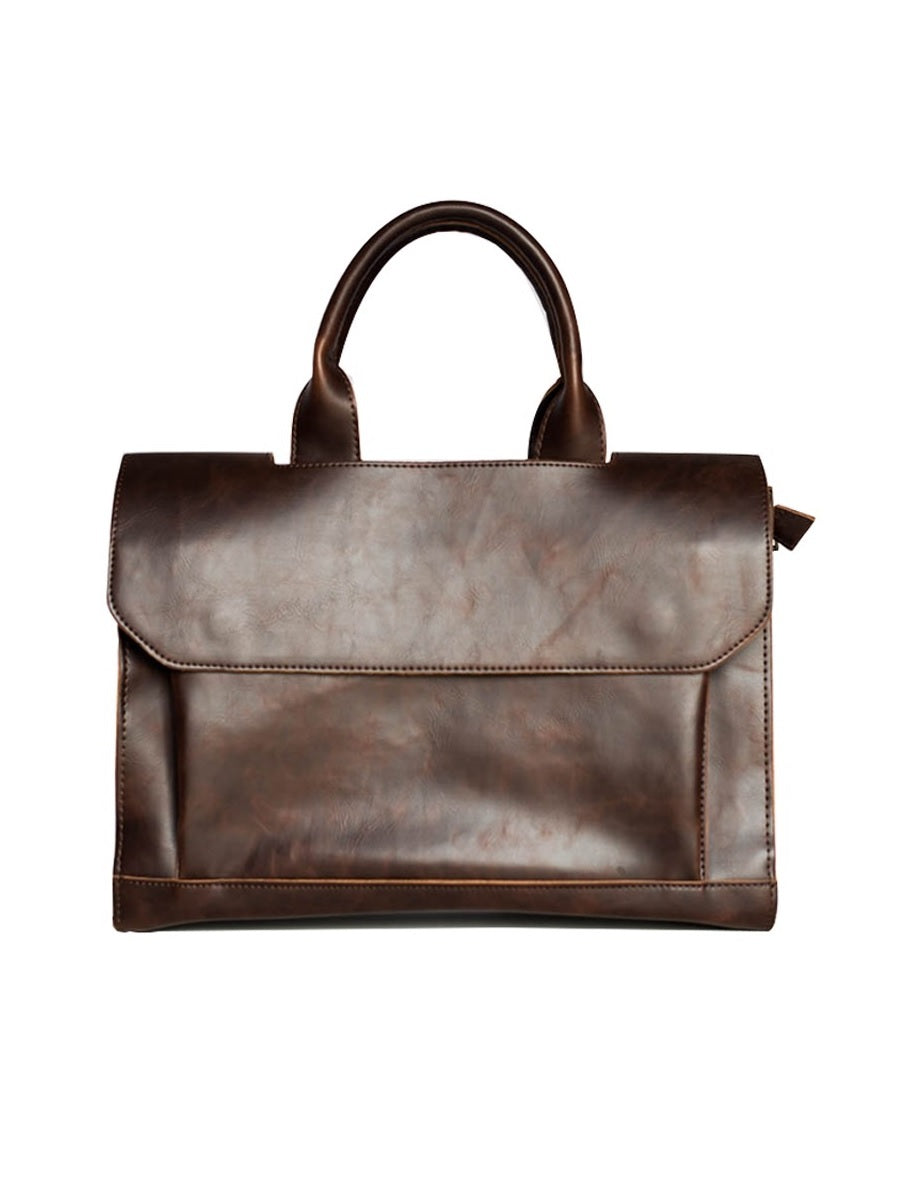 Brown leather handbag on a white background