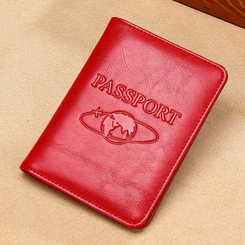 Red passport holder with 'PASSPORT' text on a beige background