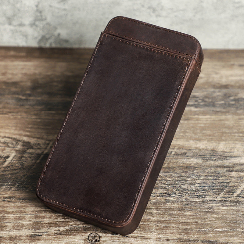 Brown leather phone case on a wooden surface