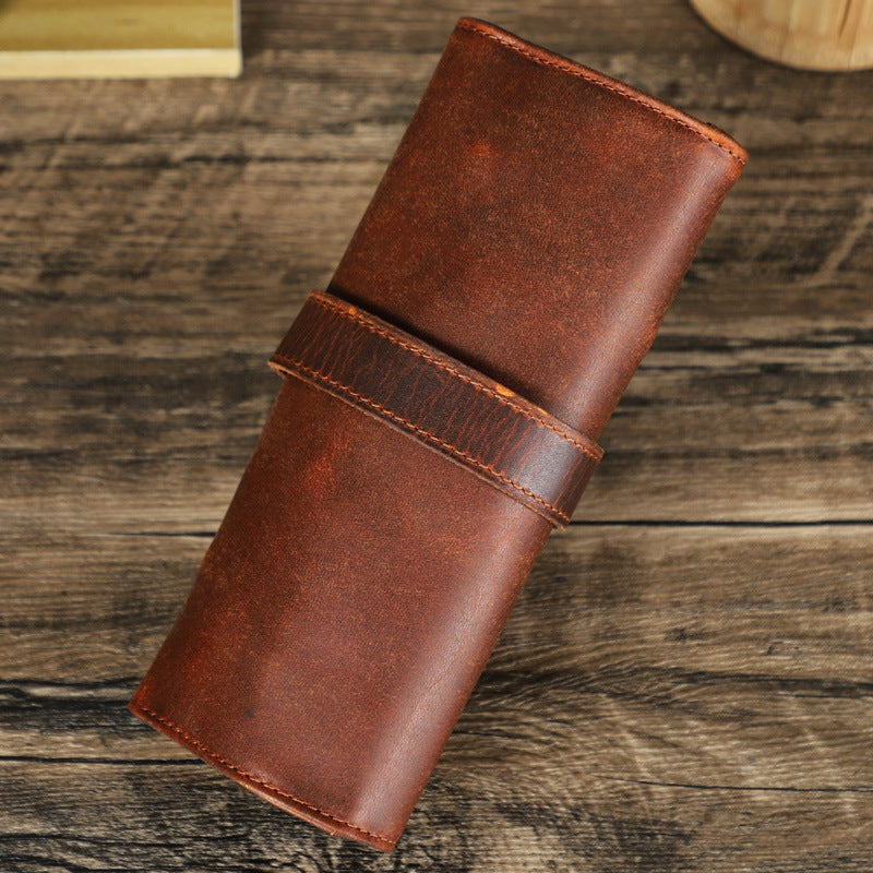 Brown leather wallet on a wooden surface