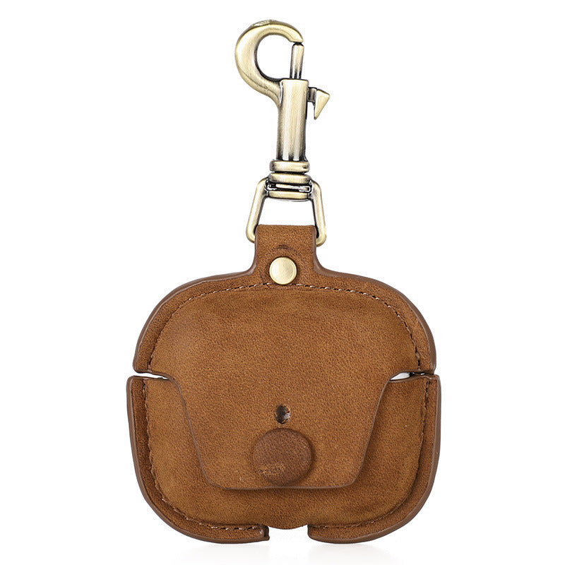 Brown leather keychain case with gold clasp on a white background