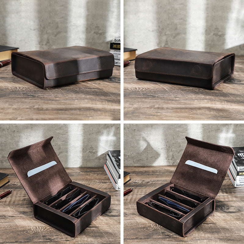 Brown leather box on a wooden surface with a concrete wall background