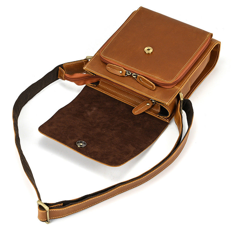 Brown leather crossbody bag on a white background