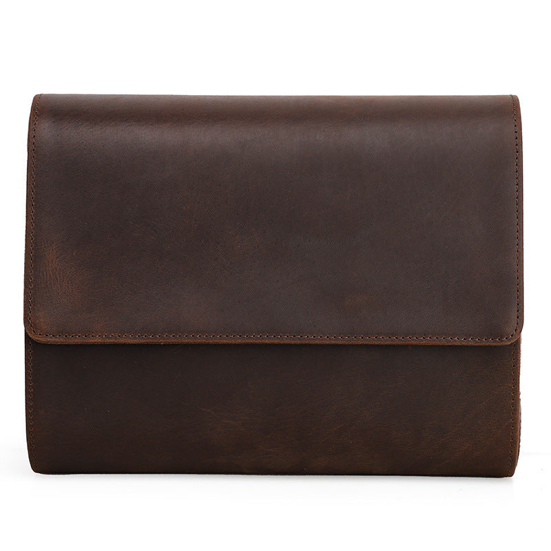 Brown leather clutch bag on a white background