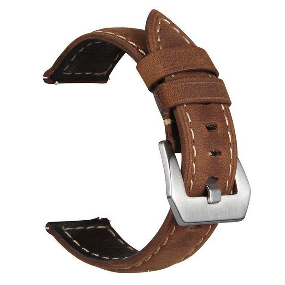 Brown leather watch strap with silver buckle on a white background