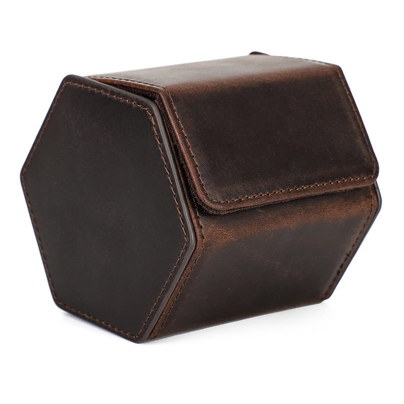 Hexagonal brown leather dice tower on a white background
