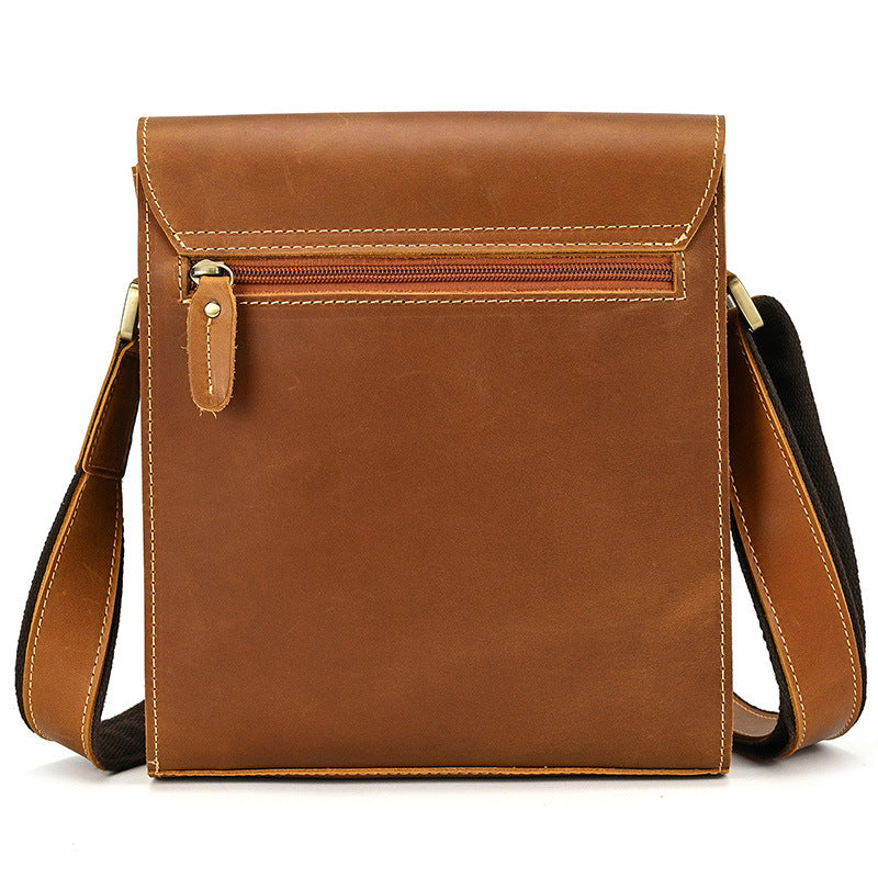 Brown leather crossbody bag on a white background