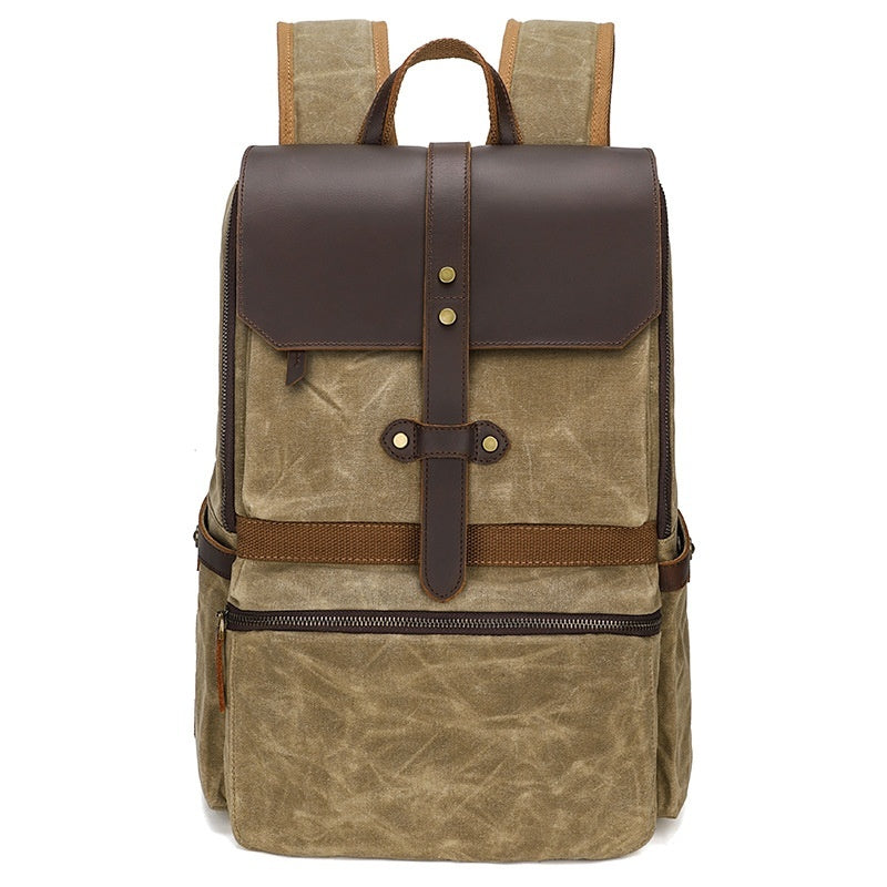 Brown backpack with leather straps on a white background
