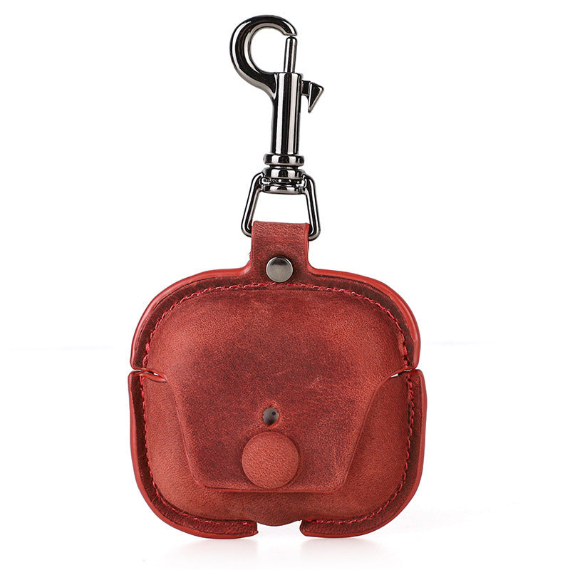 Red leather keychain case with a clip on a white background