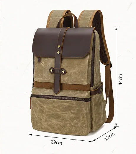 Brown backpack with leather accents and measurements on a white background