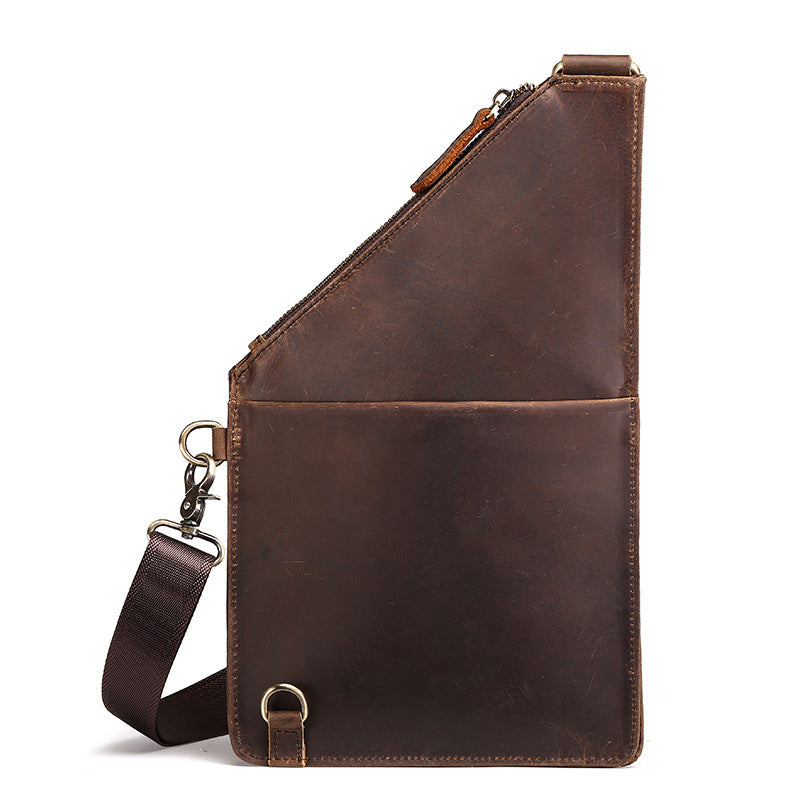 Brown leather sling bag with strap on a white background